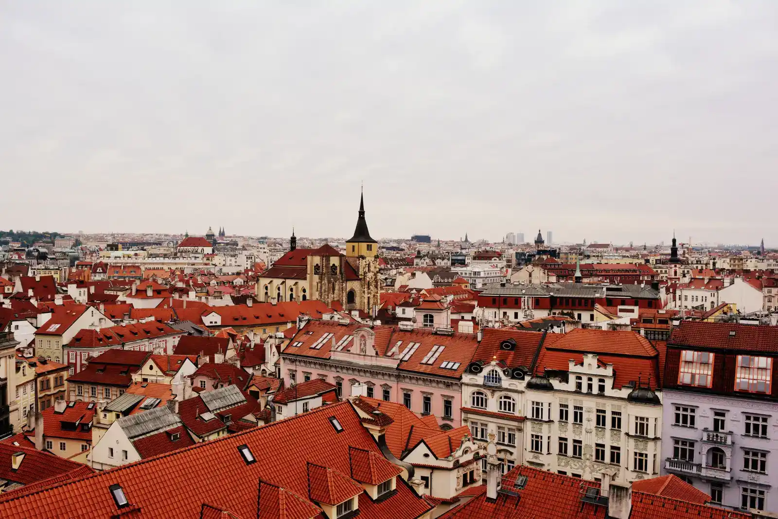 Red rooftops and spires of the Prague old town from above