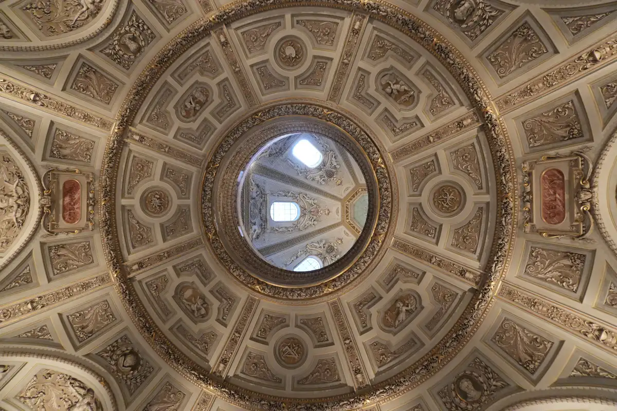 An ornate domed interior with gilded detail in Vienna