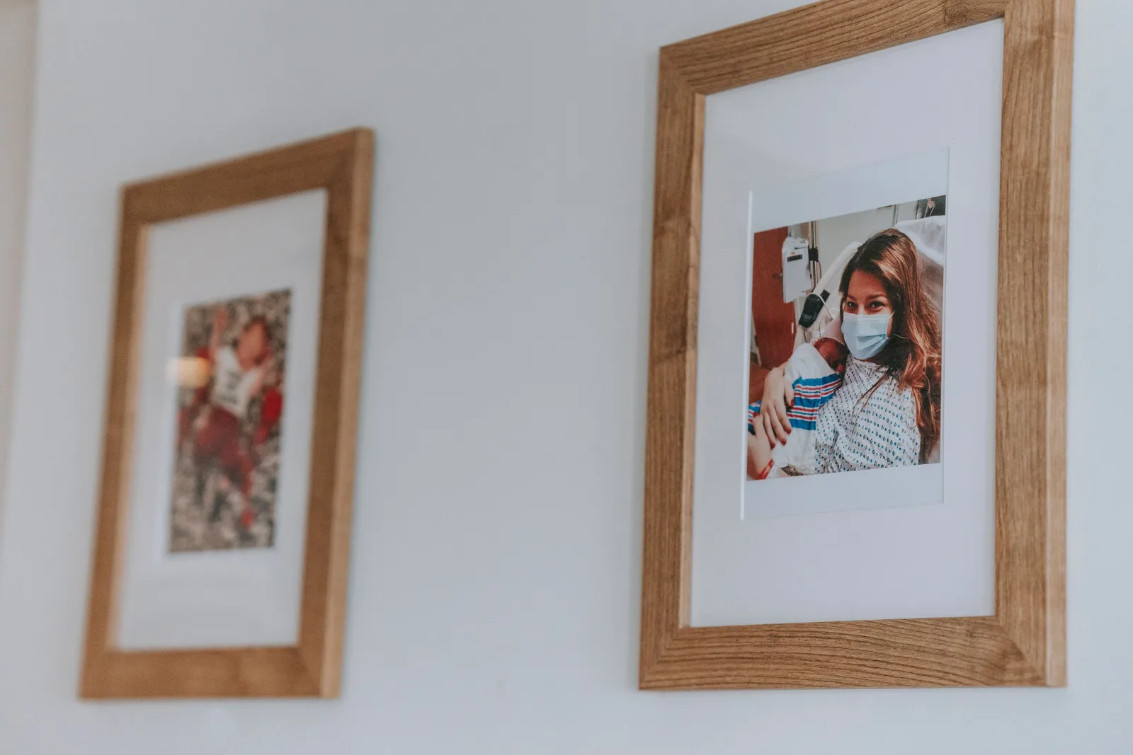 Framed photographs hanging on a living room wall