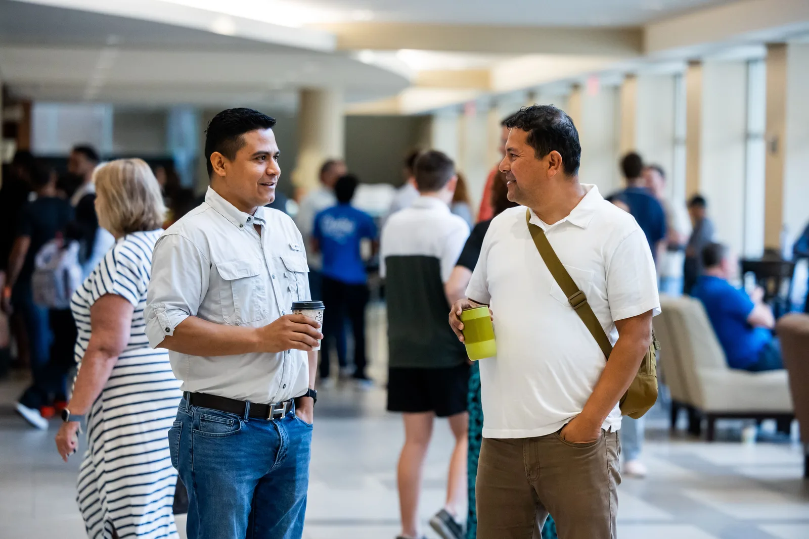 Delegates talking during a break at a corporate event