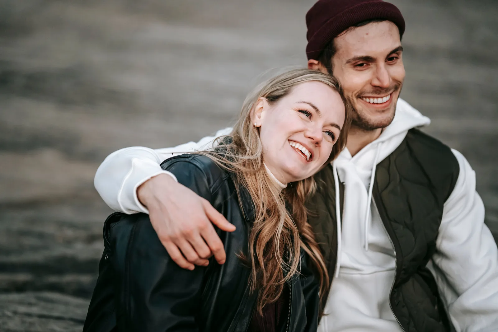 A couple laughing together during a portrait session