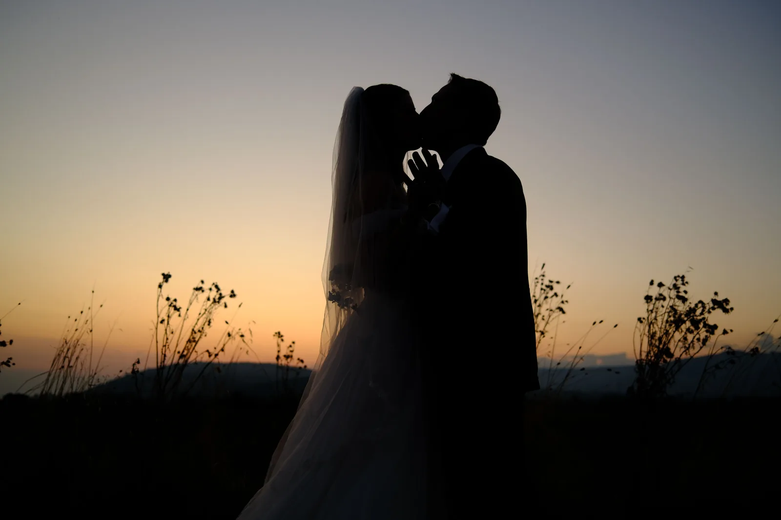 A photographer photographing a couple outdoors