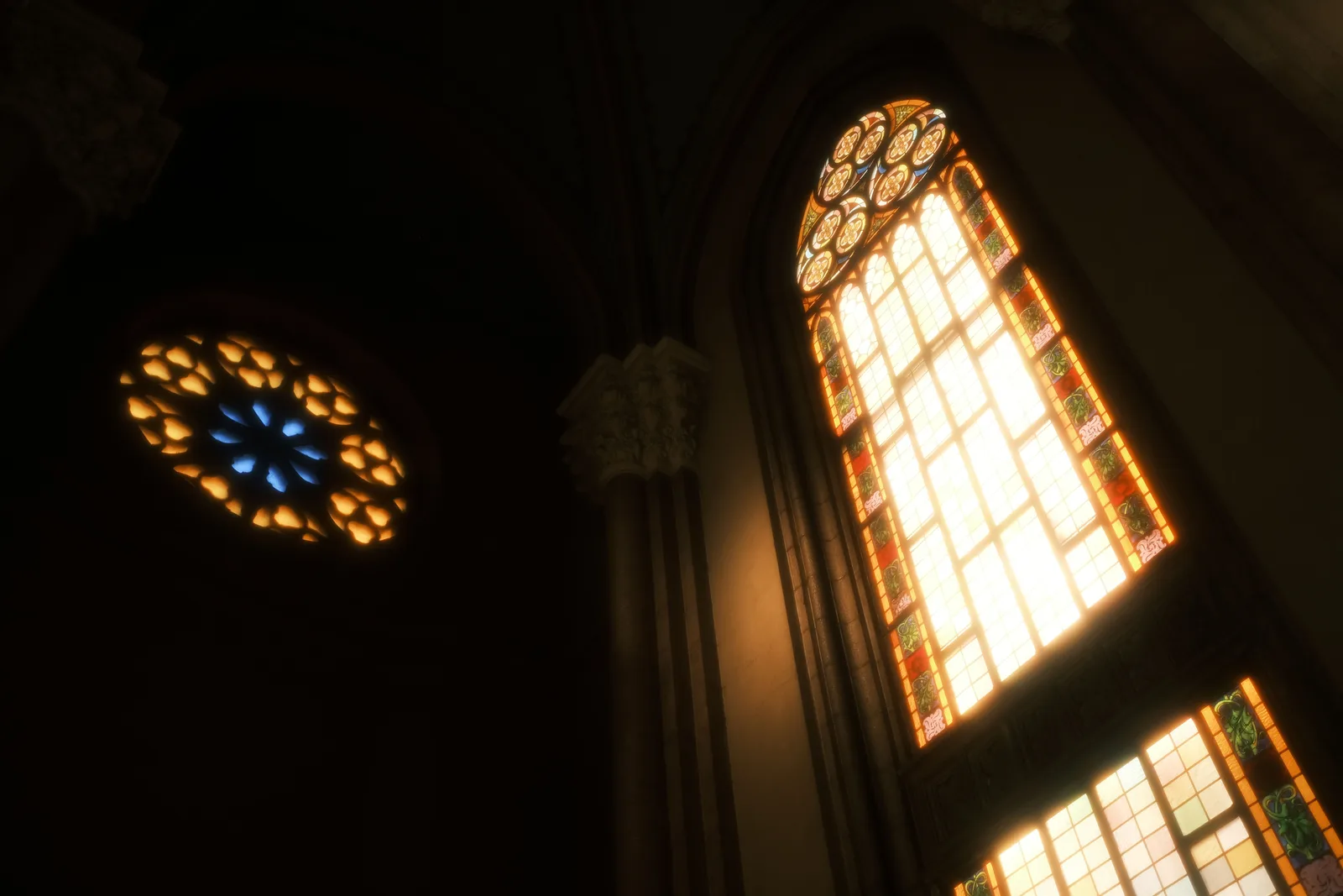 Light falling through a stained glass window into a dark church interior
