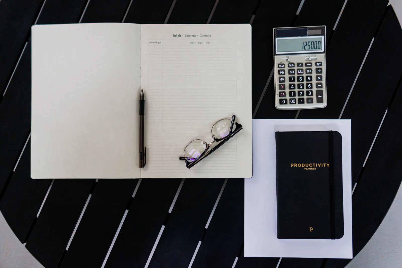 Session costs being worked out on paper at a desk