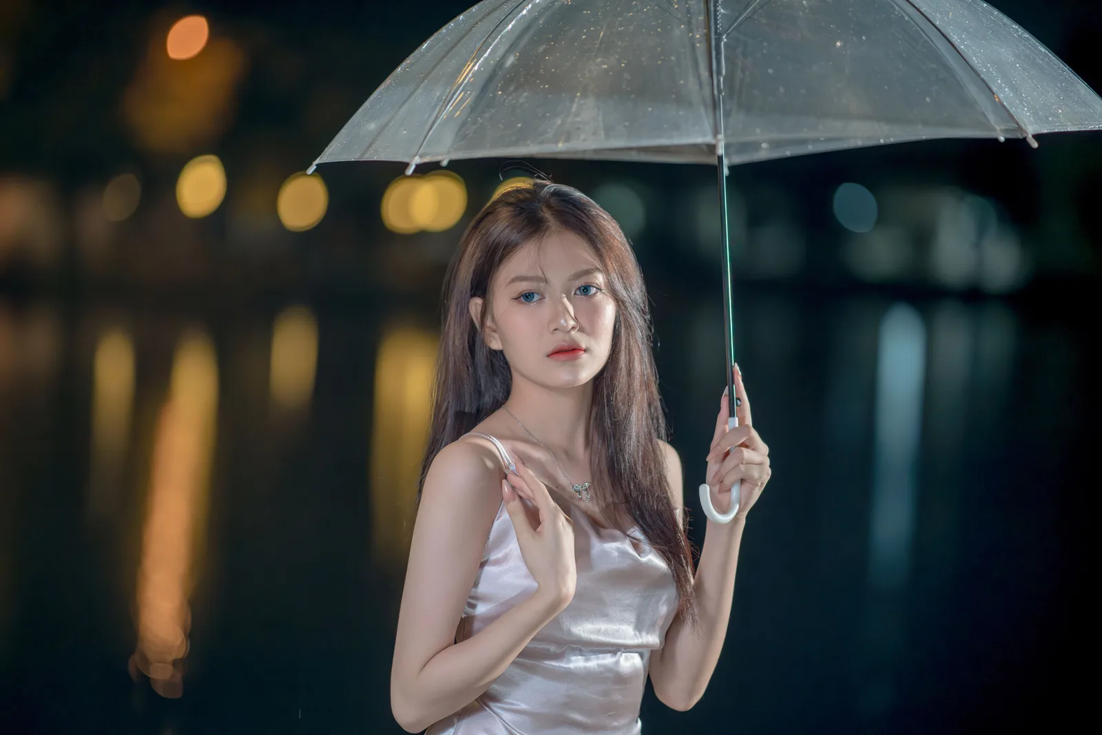 A portrait taken under an umbrella in the rain