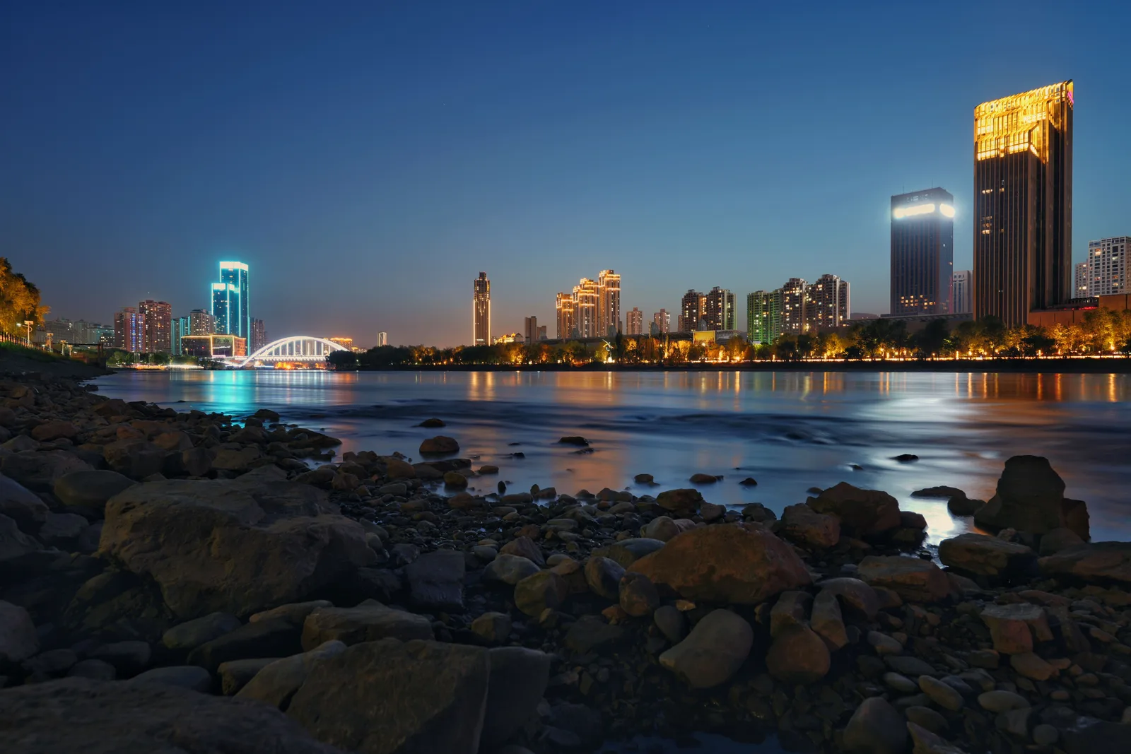 A city street photographed at blue hour on a long exposure