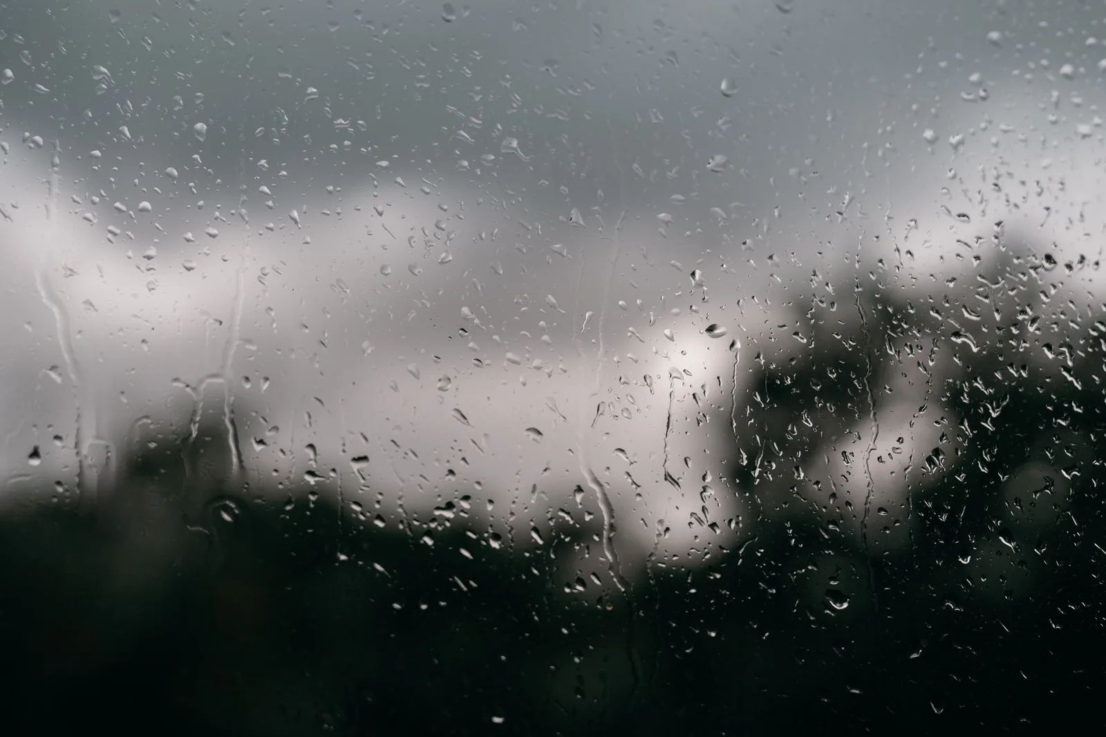 Rain running down a window on the morning of a booked session
