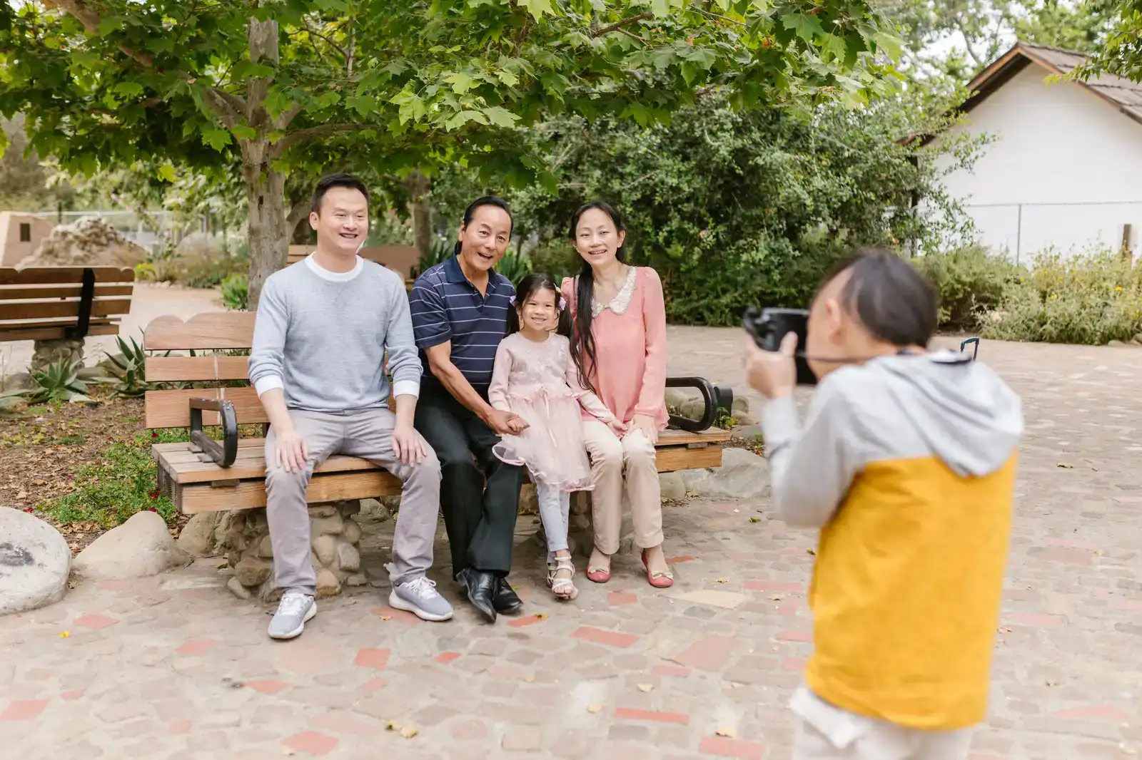 A family session in progress in a park