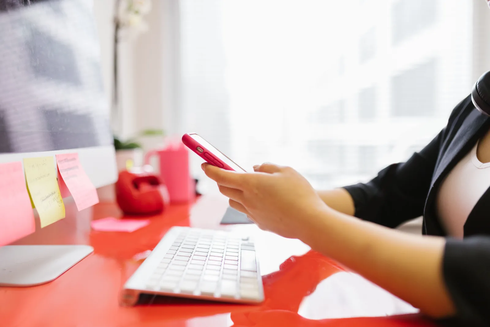 An inbox being checked on a phone at a desk