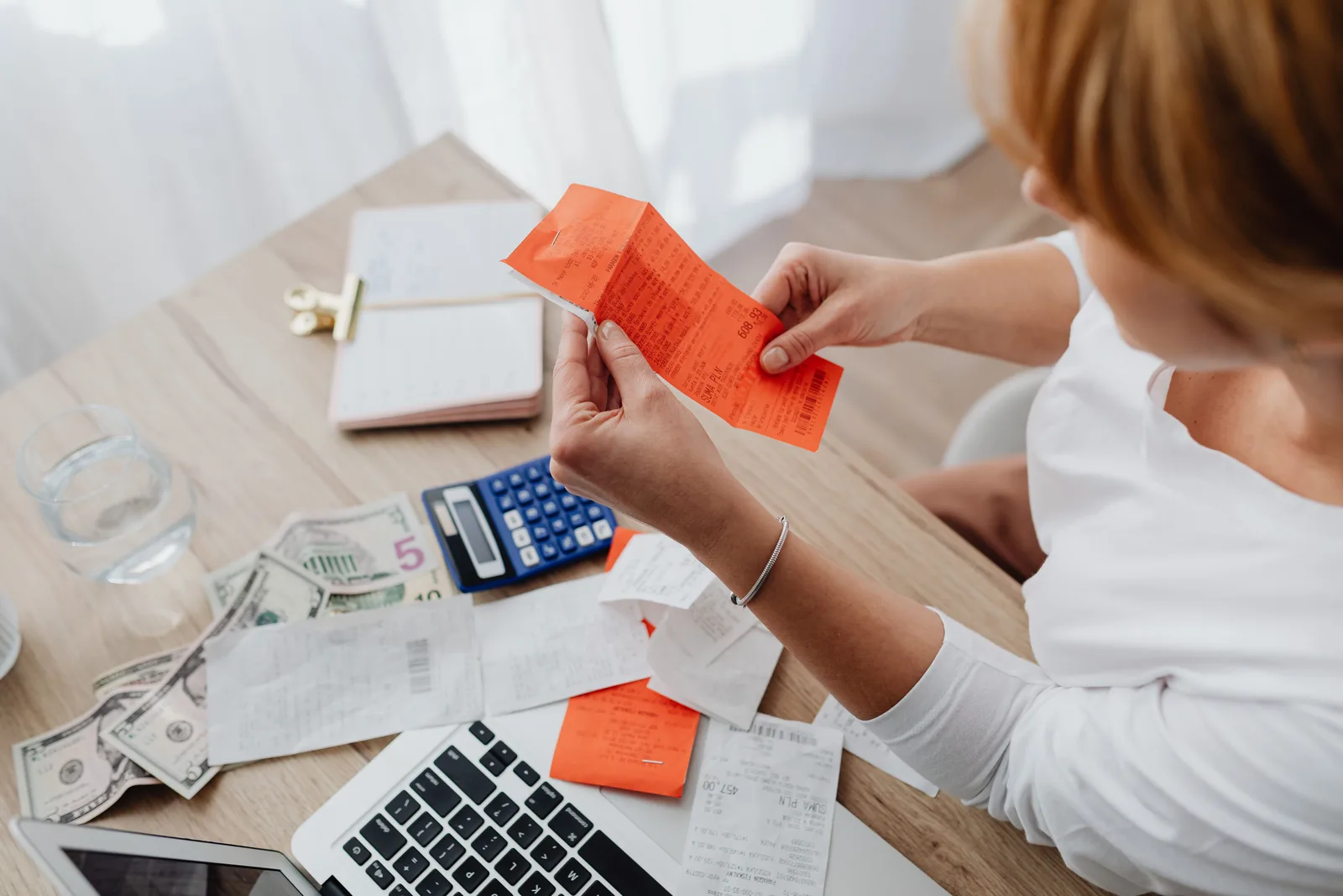 An invoice and a calculator on a desk