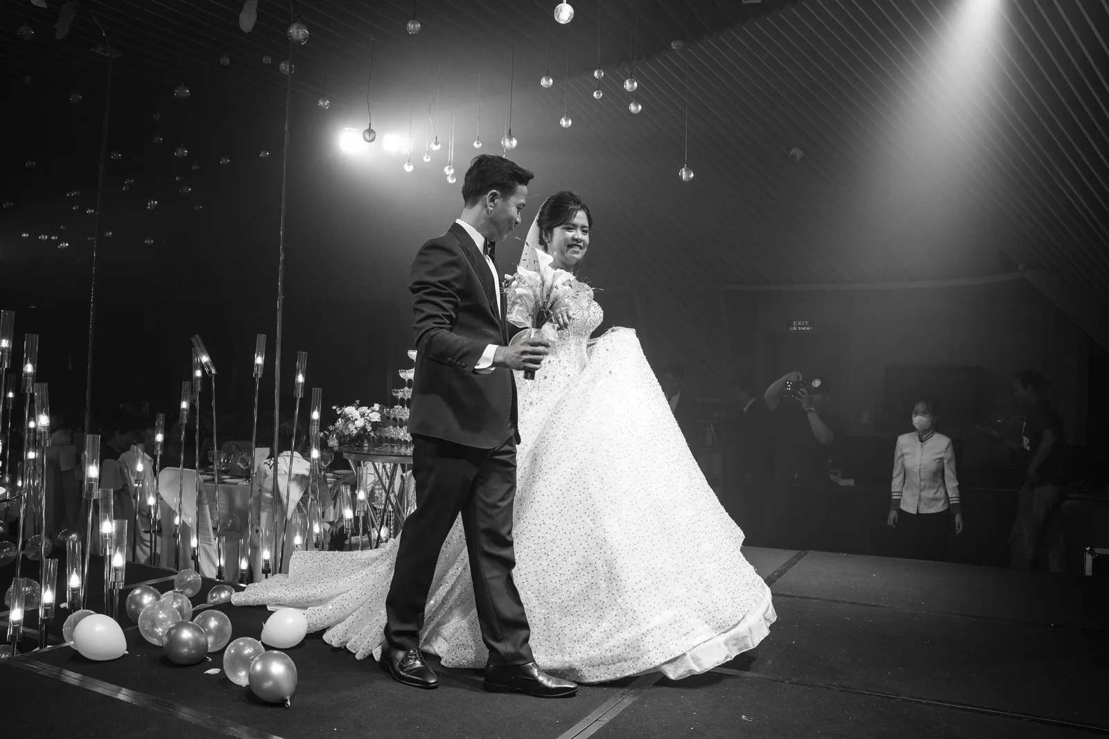 A photographer shooting candids among wedding guests