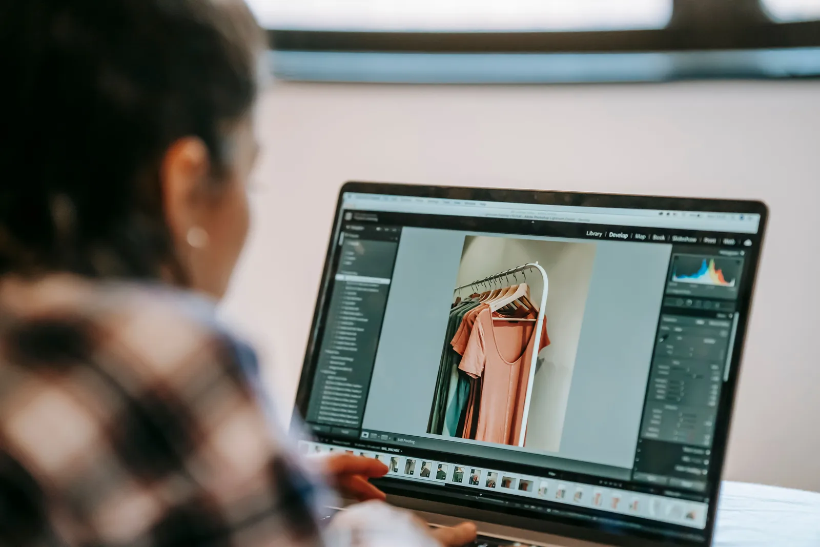 A photo being edited in Lightroom on a laptop screen