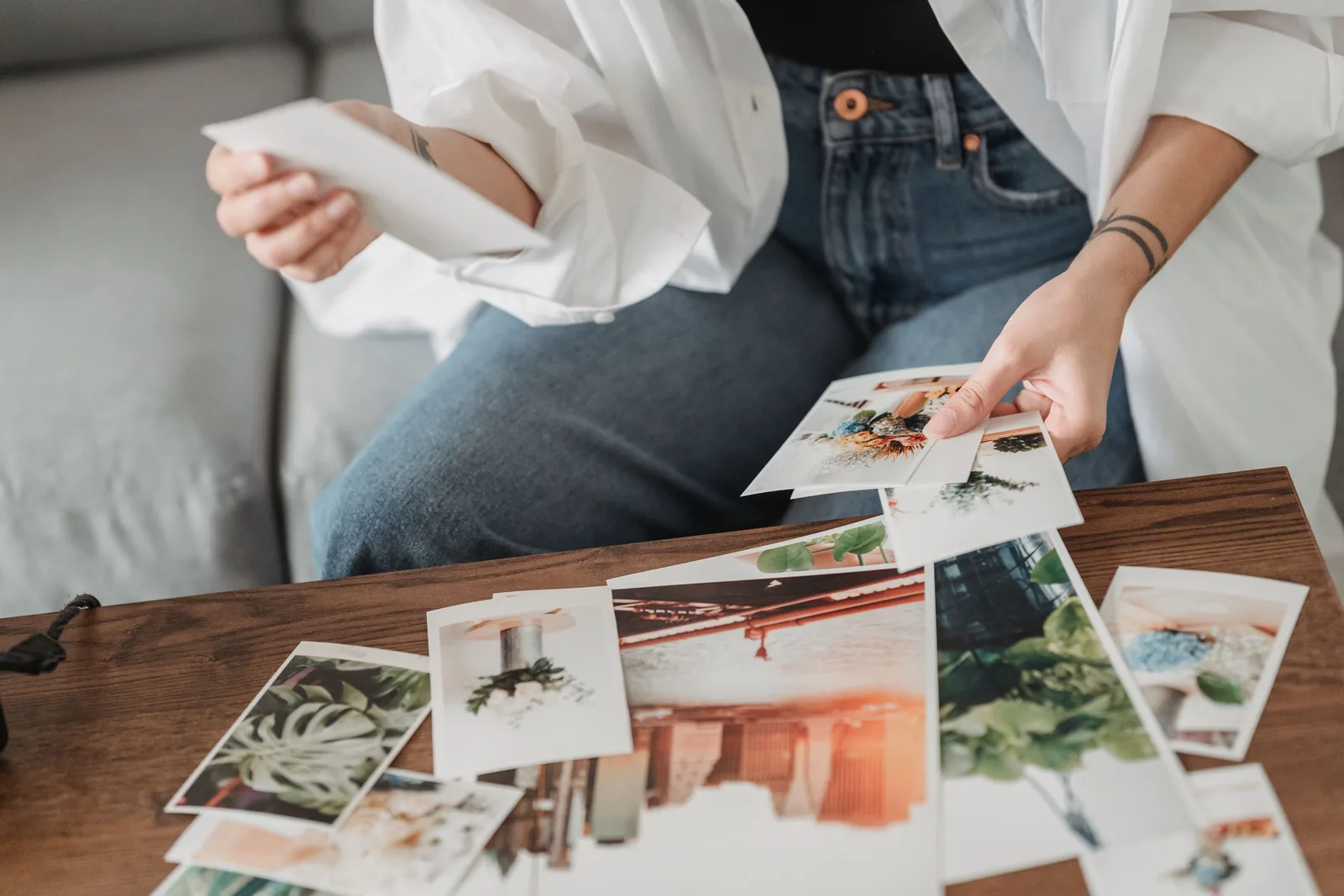 Printed photographs laid out on a table