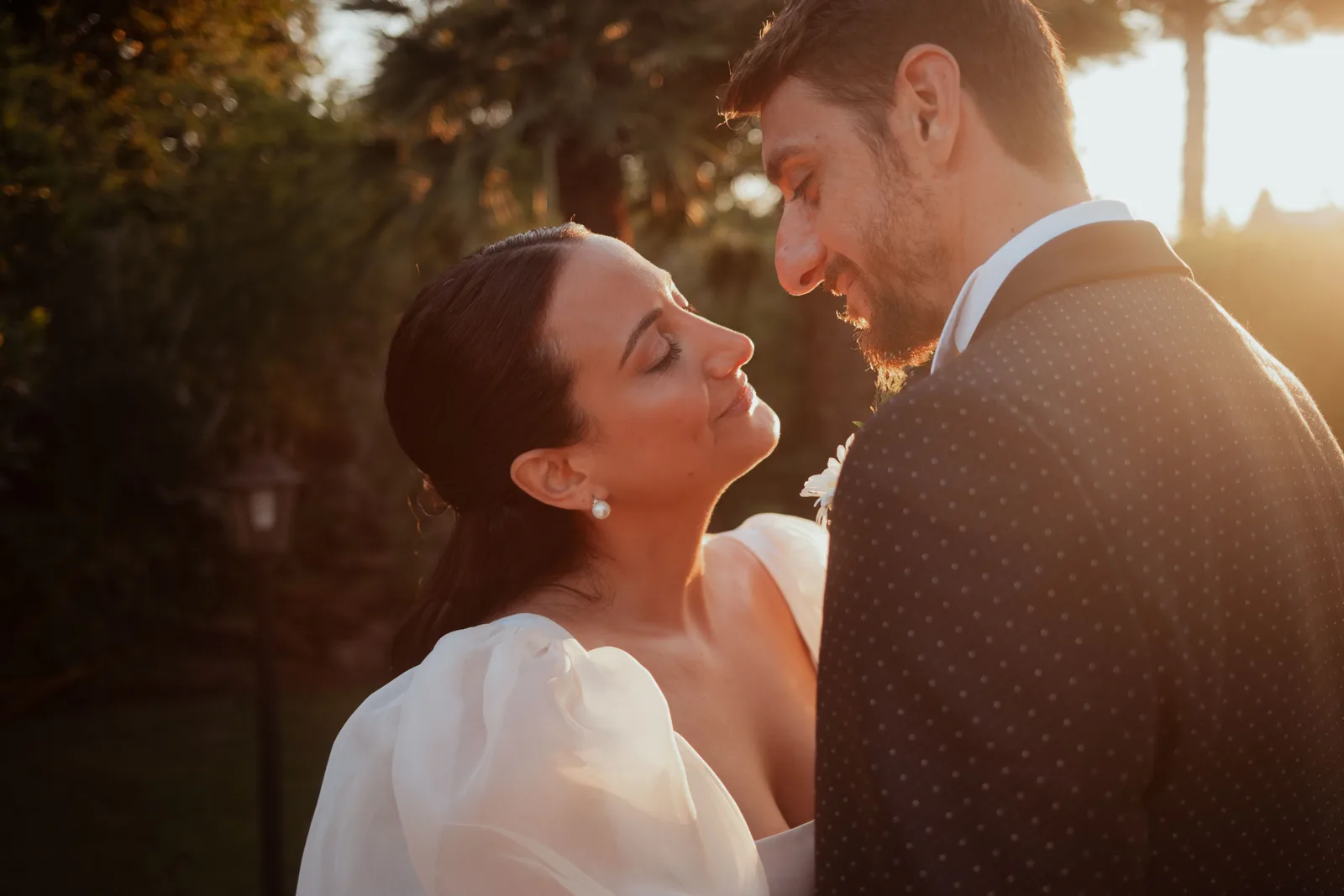 A couple photographed in the last light of the wedding day