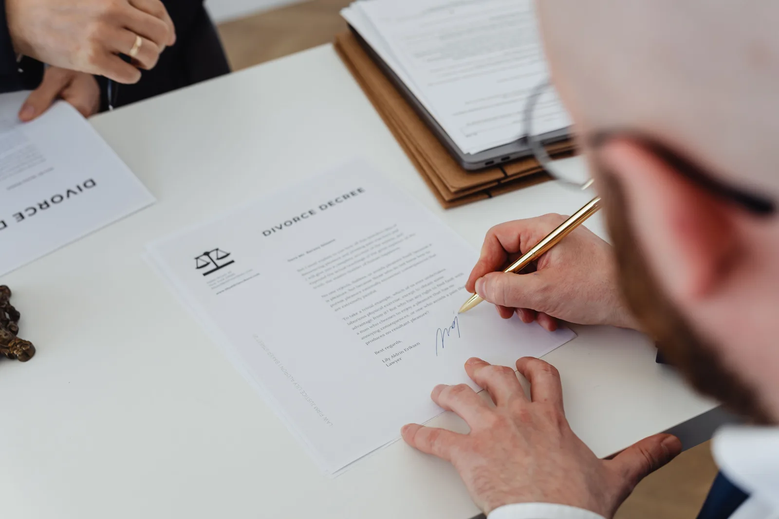 A contract being signed with a pen